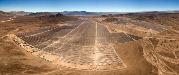 solar panel farm in the middle of the desert.